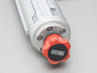 Reproduzierbare Bahnposition durch mechanisch verstellbare Spannwelle